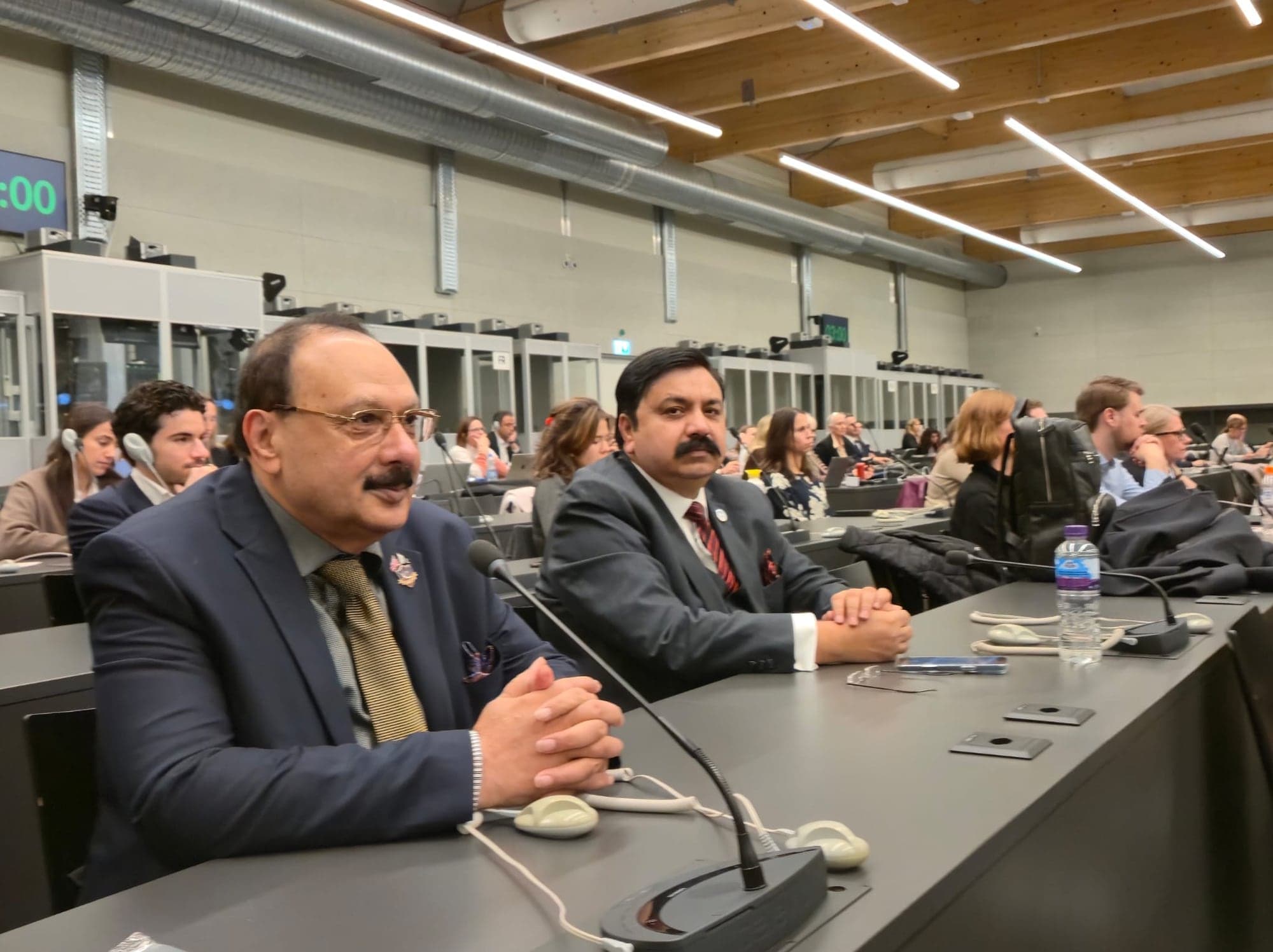 Delegates seated at a conference session