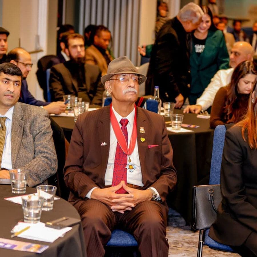 A delegate seated at a forum table