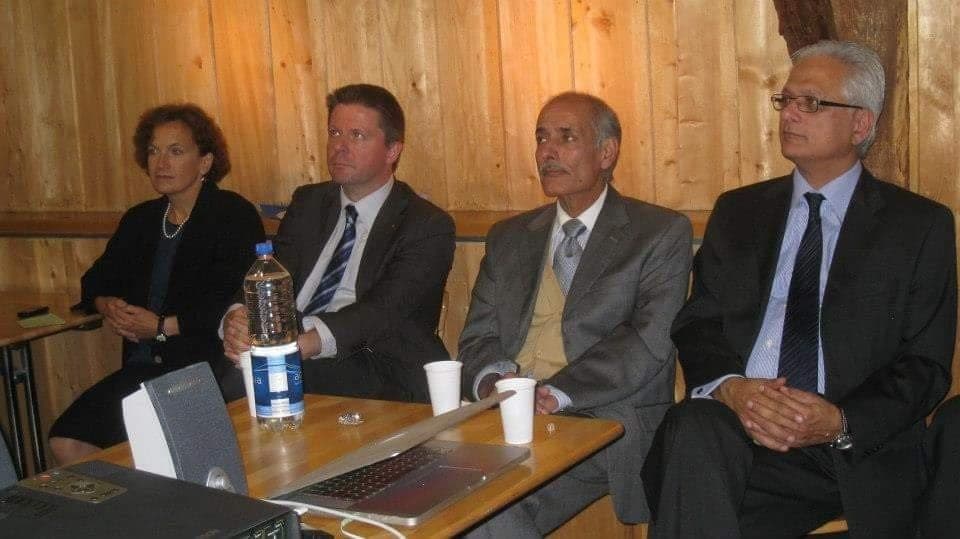 Delegates seated together at a working session