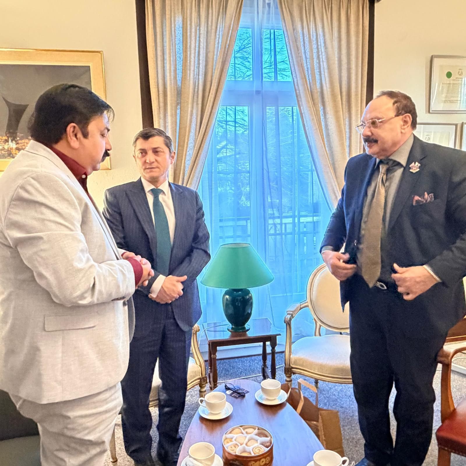 Business leaders in conversation in a reception room