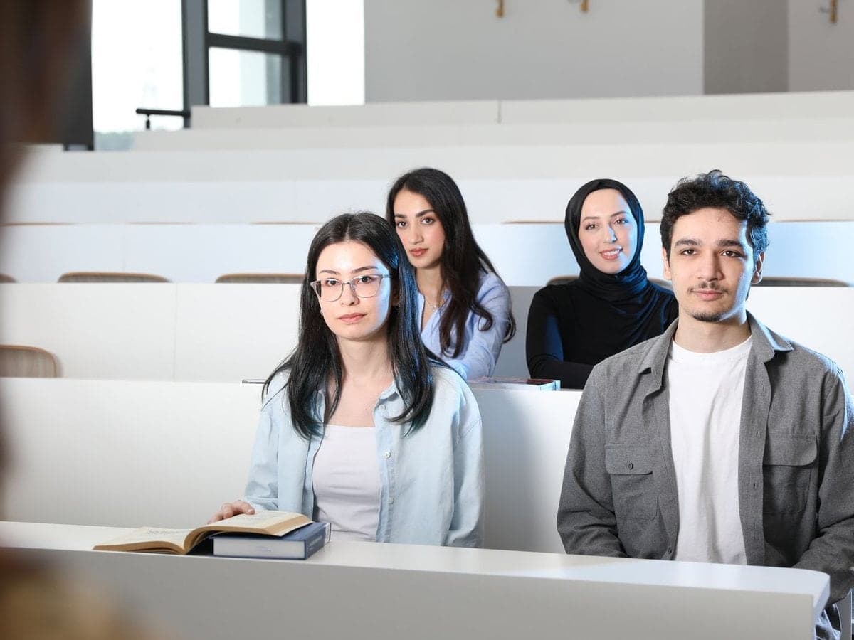 Students learning together in a lecture room