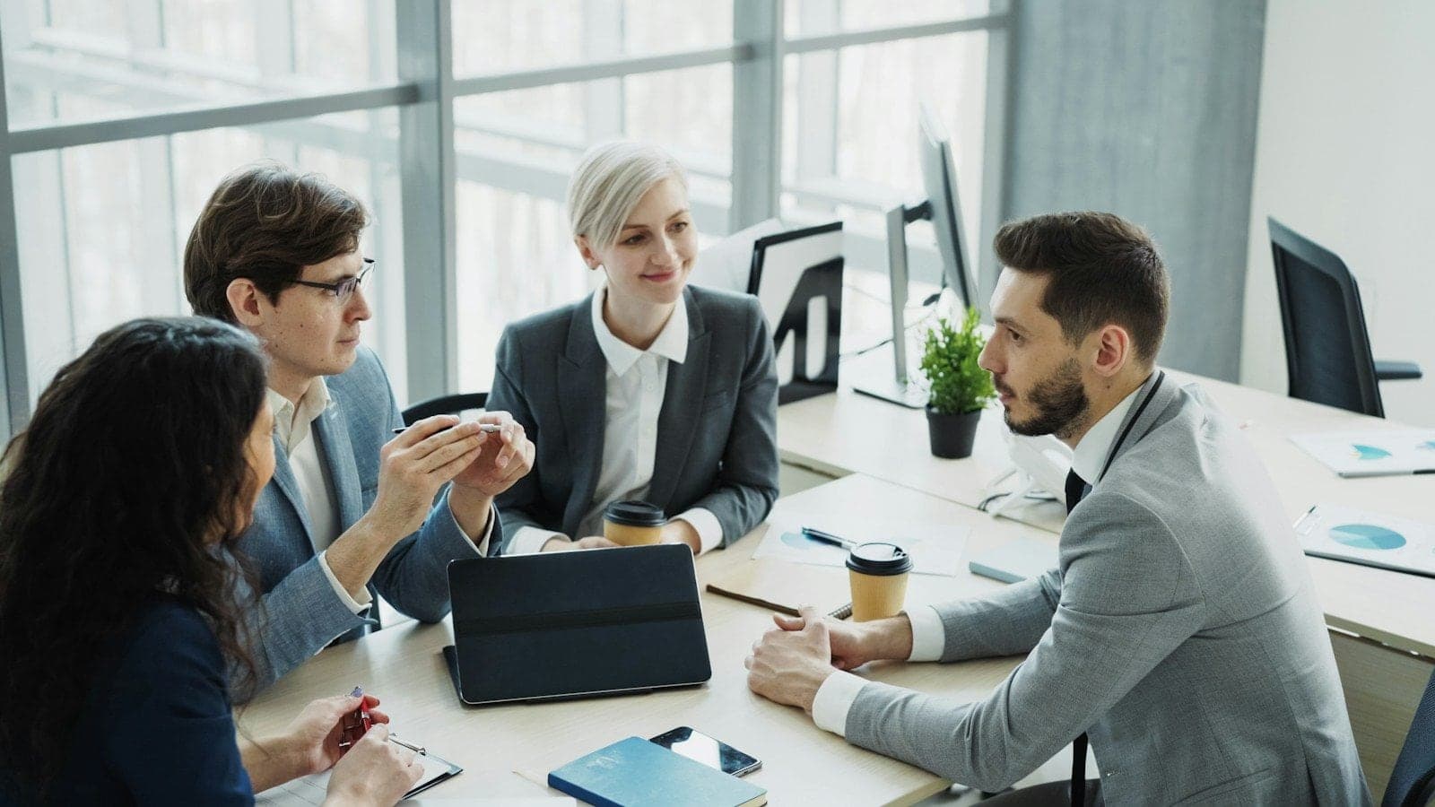 A business team meeting around a table