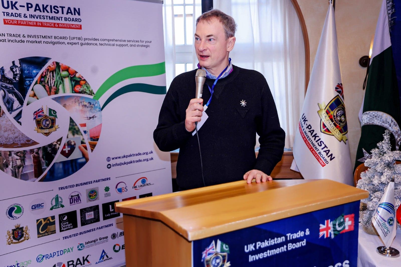 A speaker addressing delegates from the lectern