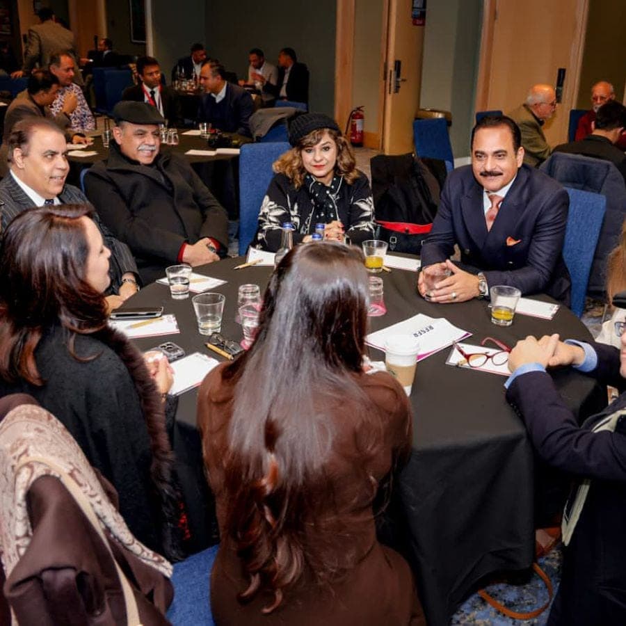 Business people in discussion around a round table