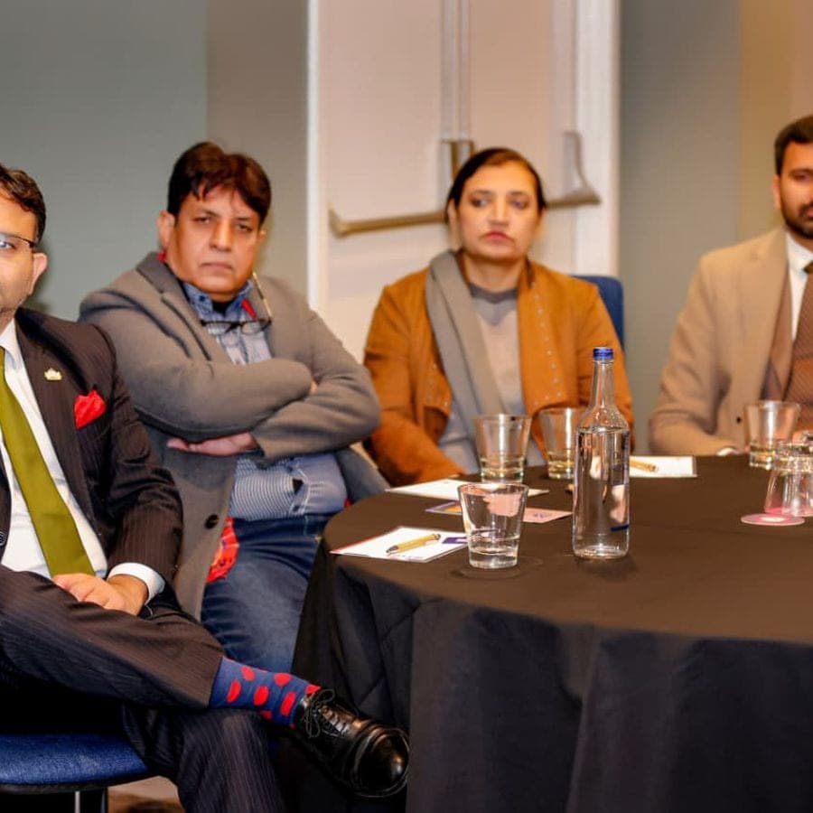 Delegates in discussion around a table