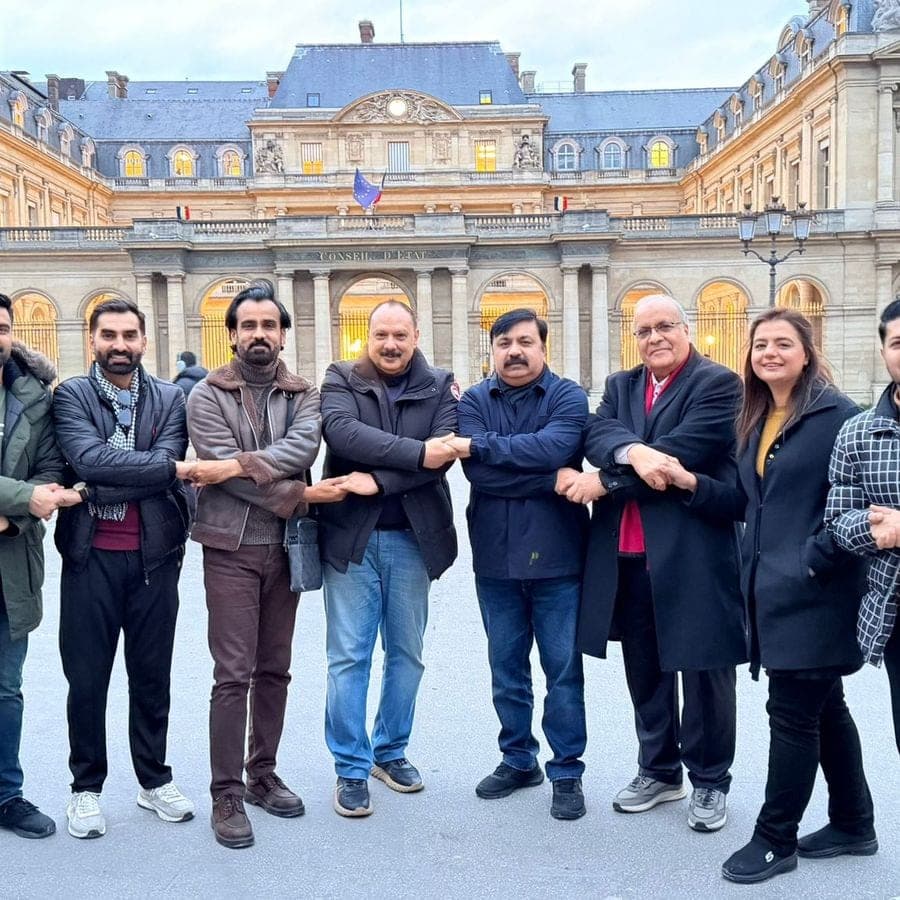Delegates standing together with linked arms