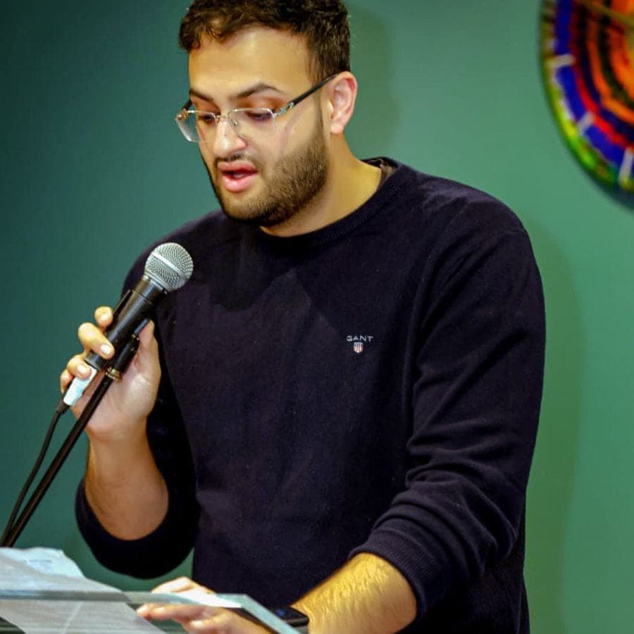 A young entrepreneur speaking into a microphone
