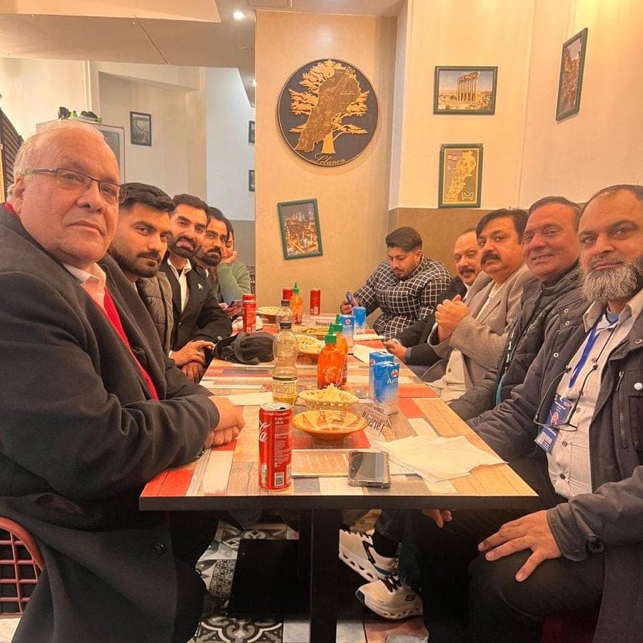 Business guests together around a dinner table